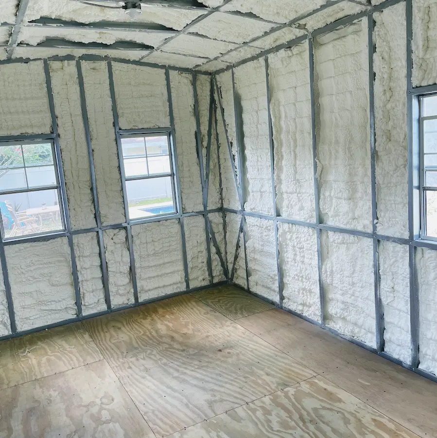 Closed-cell spray foam insulation applied to wall cavities in a residential project in Smithville